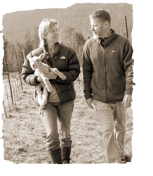 Molly and Jason Drew walk through their vineyard